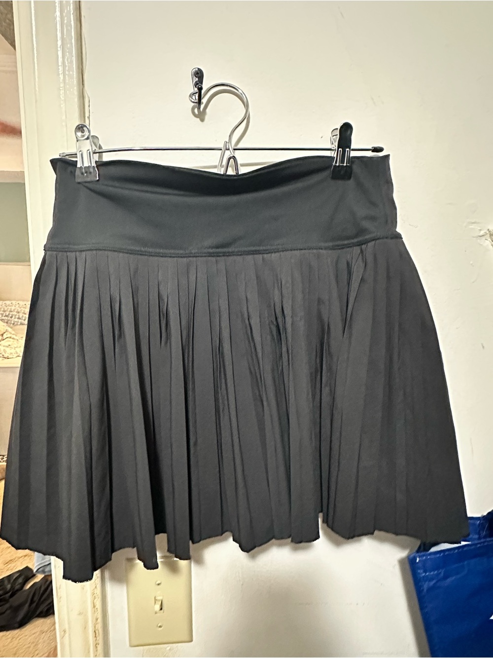 SANTINY BLACK PLEATED SKIRT with built in shorts.